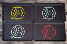 Load image into Gallery viewer, Full lineup of Brian Brown EDC Valet Trays displaying all four logo color options—yellow, red, white, and blue—arranged side by side for comparison
