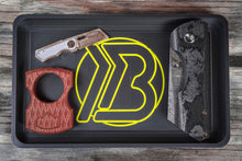 Load image into Gallery viewer, Brian Brown EDC Valet Tray featuring a yellow &#39;B&#39; logo, shown on a flat surface with space for knives, keys, and other everyday carry items