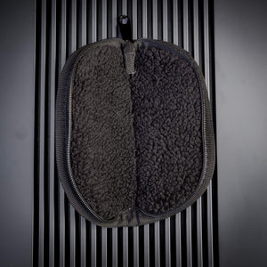 Open Brian Brown Knives zipper pouch showing the plush black interior lining designed to protect knife blades from scratches. The soft protective material fills the interior space, with the zipper fully extended to display the complete storage capacity for a single knife.