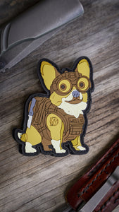 Tactical Wells PVC Patch featuring a corgi in full gear with night vision goggles, plate carrier, and Yeager-M rifle