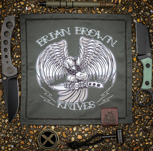 Raptor Hank featuring detailed artwork of a raptor holding a Raptor knife in its claws, printed on soft polyester blend fabric with microfiber backing